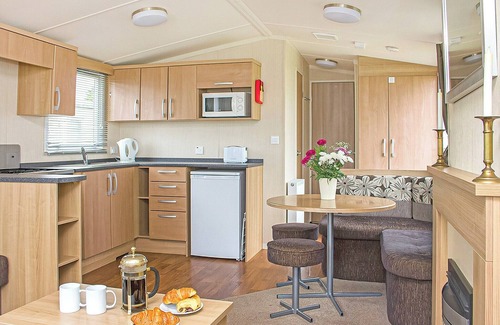 Looe House | 12ft-wide caravan with one double and one twin.