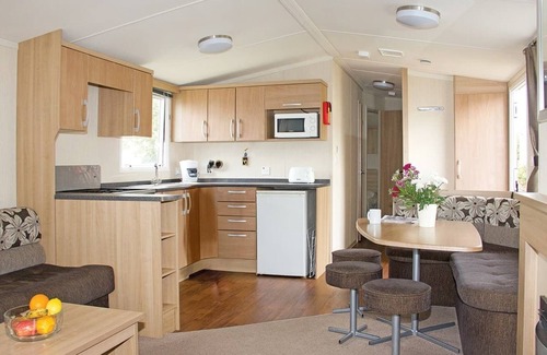 Looe House | 12ft-wide caravan with one double and one twin.