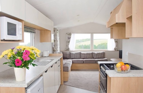 Looe House | 12ft-wide caravan with one double and one twin.