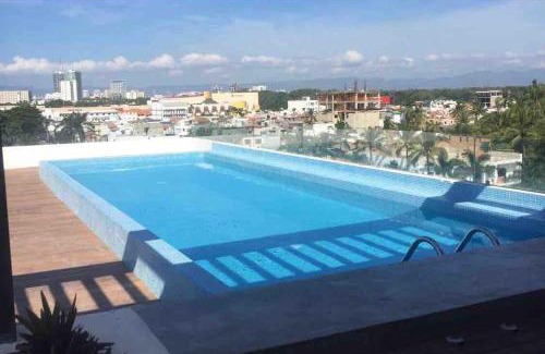 Diaz Ordaz Apartment | 15 Minute Walk to Beach KING Bed Rooftop Pool