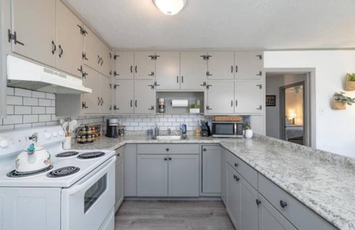 Covington House | 2 bedroom beauty with patio and yard, next to legion field