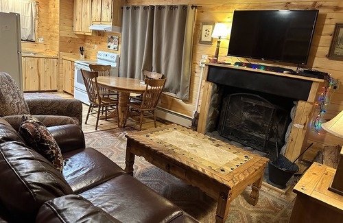 Greer Cabin | 2 BR-1BA Log Cabin on Main Street. Stocked trout pond, fireplace, porch, Dogs Ok