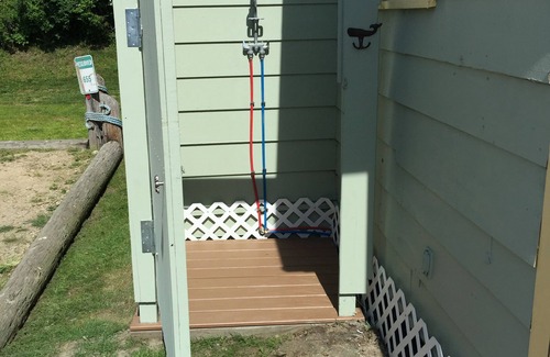 Snug Harbor Cottage | 2 BR East Matunuck cottage 7 min walk to beach, steps from Salt Pond