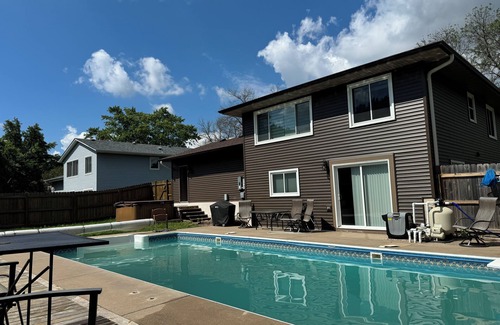 North Saint Paul House | 2000 sq ft home with a swimming pool and a hot tub