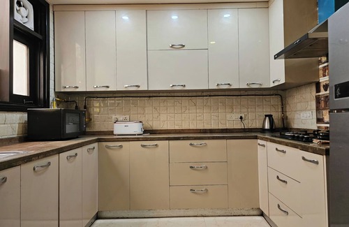 New Delhi Apartment | 3BHK Apartment,Relaxing Terrace,Greater Kailash-1, M Block Market by HostMyStay
