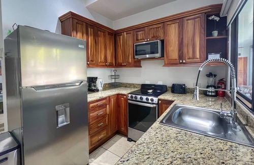 Coco Condo | 5-minute Walk to Beach & Town - Gated - Pool & BBQ