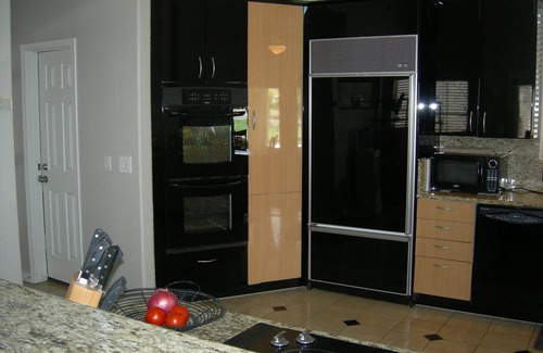 The Islands House | 5 STAR Lakefront home, free heated pool, kayaks, close to airport access,