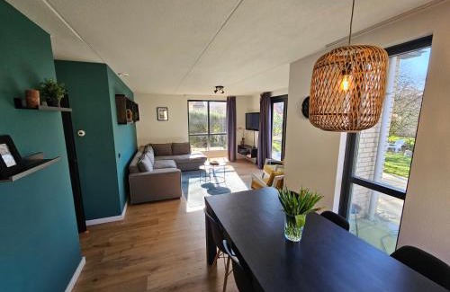 Ewijk House | 7 person House with garden, firepit, swimming lake, hammock, child friendly, in- and outside playground, slide, and great coffee