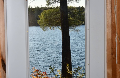 Deblois Cabin | 900 sq/ft off-grid cabin nestled on Upper Cranberry Lake. Pet Friendly!