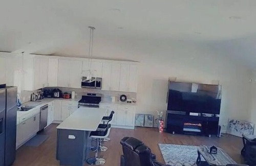 Oak Lawn House | A cozy bedroom in a home with high-tech amenities
