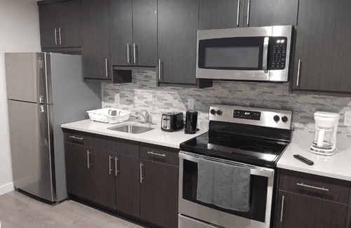 Saskatoon House | A cozy one bedroom suite located in the peaceful neighborhood of Evergreen.
