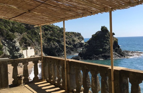 Rosignano Marittimo House | A house directly on the sandy beach with rocky coast, dreamlike object, view unique