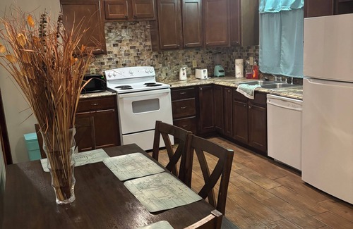 Petersburg House | A large room in Prince George County that has a King size bed and an ensuite.