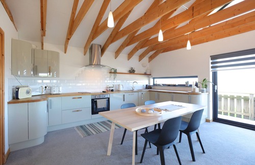 Dunbar Apartment | A modern, seafront chalet offering stunning beach views of Belhaven Bay.