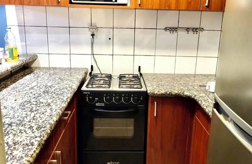 Santa Rosa Condo | A small mansion with a large swimming pool in a botanical garden