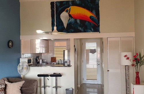 Santa Rosa Condo | A small mansion with a large swimming pool in a botanical garden
