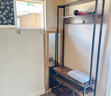 Norwalk House | A small room in the backyard with a full bed