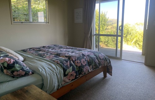 Awhitu House | A sunset paradise, 3 bedroom home on a hill with views to the ocean
