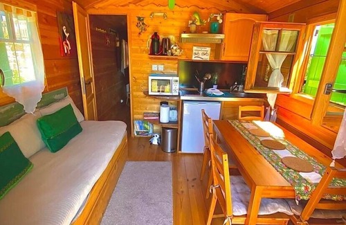 Cublac Ski Chalet | A wooden caravan at Domaine de la Morétie