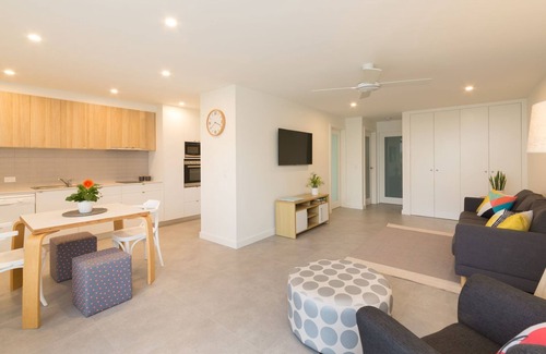 Woolgoolga Apartment | Absolute beachfront location, king size bed to relax and recover.Lock up garage