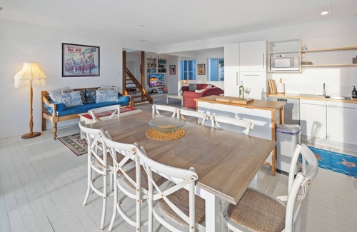 Scotts Head House | Absolute waterfront beach house with massive deck - family and dog friendly