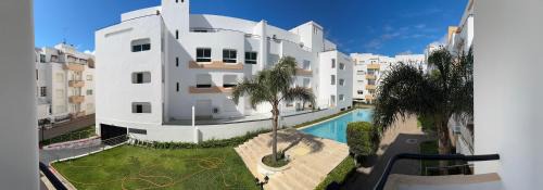 Achakkar Apartment | Achakkar Hills Seaside Family Apartment with Pool, Beach Access, AC, Parking, Play Area