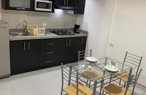 Banos de Agua Santa Apartment | Acogedora suite para parejas con jacuzzi en la habitación a 2 min del centro