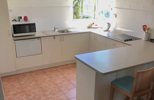 Nelly Bay Apartment | Across from beach! Wake up to beautiful sunrises, lush greenery & passing boats