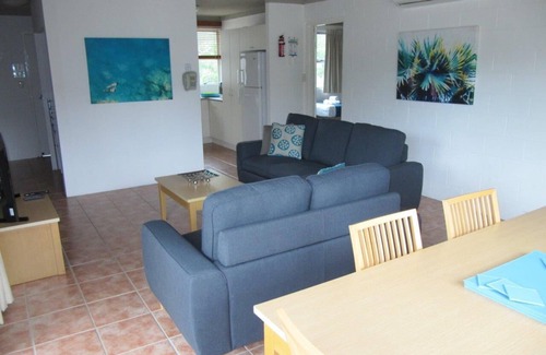 Nelly Bay Apartment | Across from beach! Wake up to beautiful sunrises, lush greenery & passing boats