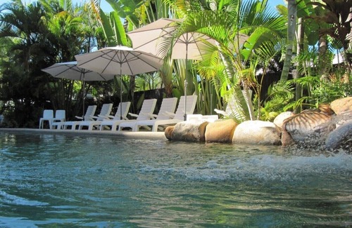 Nelly Bay Apartment | Across from beach! Wake up to beautiful sunrises, lush greenery & passing boats