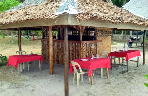 Mimaropa House | Acuario beach inn is a beach front area. A native hut which has 3 rooms inside.