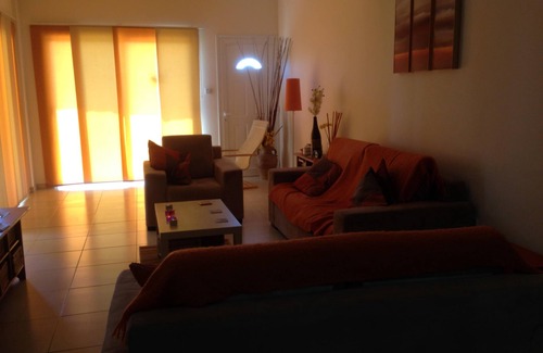 Oroklini Apartment | Adonis-Ground Floor Apartment with Secure Private Garden. Free use of car & Wifi