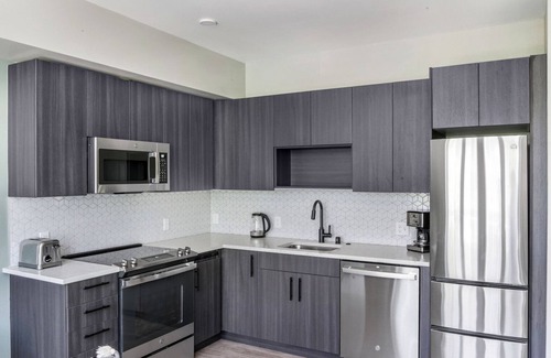 Squire Park Apartment | Amazing First Hill Jr 1BR w/Roof Lounge & Bike Storage, by Blueground