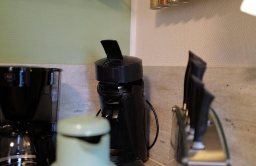 Punderich Apartment | An apartment with a terrace and a roofed balcony, with a view of the Schiefer