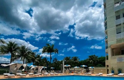 Camboinhas Apartment | Apart Hotel Alecrim Praia de Camboinhas with Marina standing on the sand
