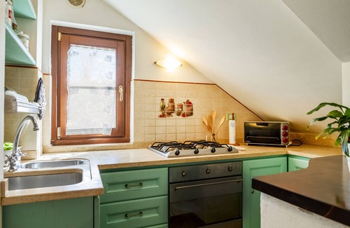 Le Rocchette Apartment | Apartment 'Villa Rosanna' with Private Terrace, Private Garden and Air Conditioning