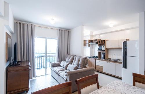 Nossa Senhora da Paz Apartment | Apartamento 150m da PRAIA com SACADA, WI-FI AR CONDICIONADO, PISCINA, PORTARIA 24h, PLAYGROUND e vaga de GARAGEM