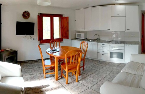 Santa Pau Apartment | Apartment 'Mas El Carrer - Blanc' with Shared Pool, Shared Garden and Wi-Fi