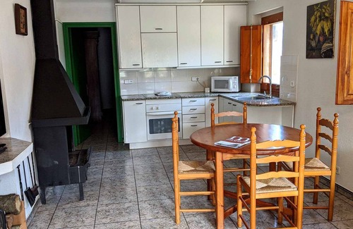 Santa Pau Apartment | Apartment 'Mas El Carrer - Verd' with Shared Pool, Shared Garden and Wi-Fi