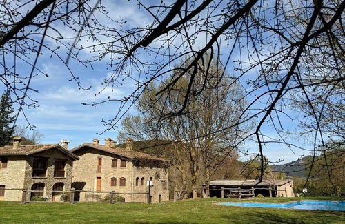 Santa Pau Apartment | Apartment 'Mas El Carrer - Verd' with Shared Pool, Shared Garden and Wi-Fi