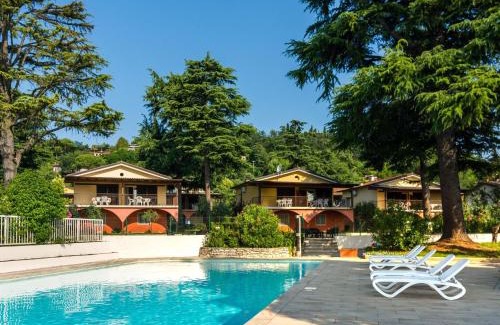 Villaggio Sanghen House | Apartment on Lake Garda with pebble beach pier for boat three swimming pools