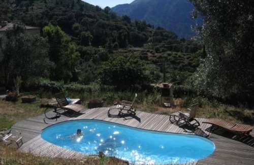 Olmiccia Apartment | Apartment with balcony and pool in a superb stone and wood chalet