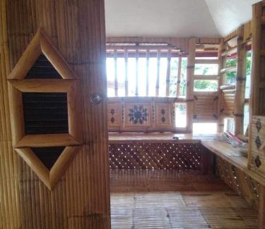 San Juan Bed & Breakfast | Aremen Transient, Nipa Hut with shared main houses bathroom