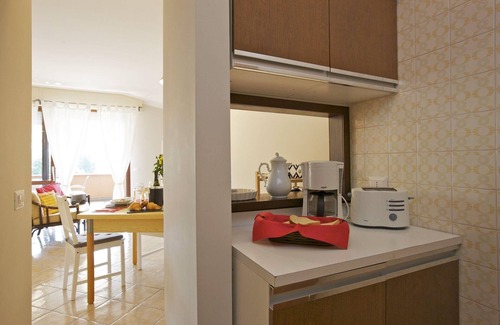Susello Apartment | Attractive studio with balcony, pool and dream view