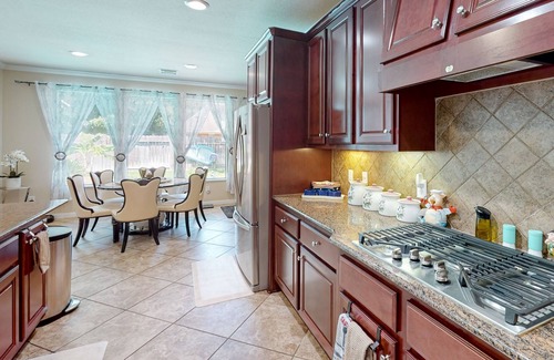 Cypress House | Azal House | Luxe house in Cypress with a pool, hot tub, & gourmet kitchen