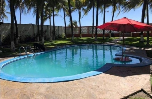 Playa El Pimental House | Beach from house, 3 rooms with air conditioners, 43 coconut trees, 7 hammocks