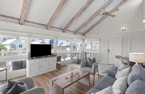 Seacrest House | Beach Retreat w Sundeck Golf Cart Bikes Bungalow House by AvantStay