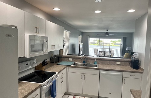 Pelican Condo | Beautiful Family Sized Condo with Private Pool and Pier