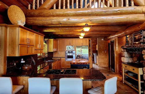 Tower House | Beautiful handmade log home on private sand beach at the end of Big Bay