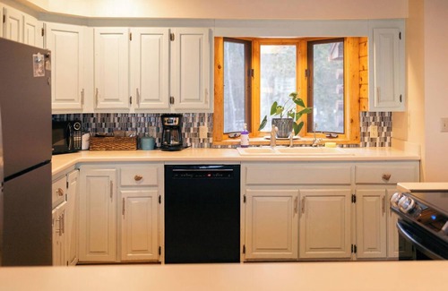 Suttons Bay House | Beautiful Log Cabin on the Bay!